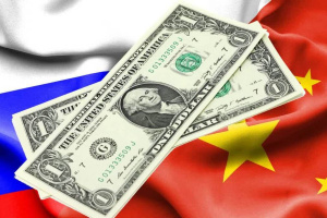 دلار تقریبا از مبادلات تجاری مسکو و پکن حذف شد